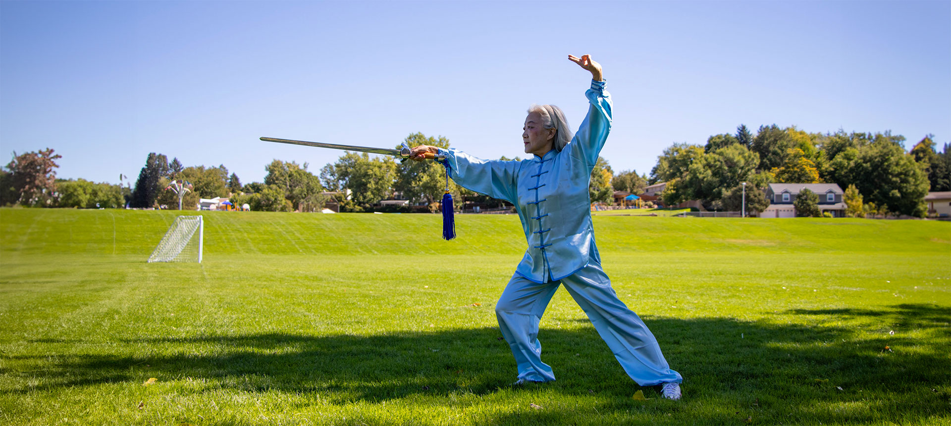 Woman dowing Tai Chi in the park